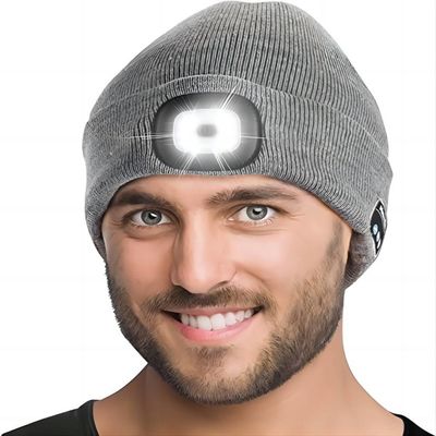 Le chapeau d'écouteurs de Bluetooth de sports remet librement avec des entretiens Flahslight de téléphone de musique