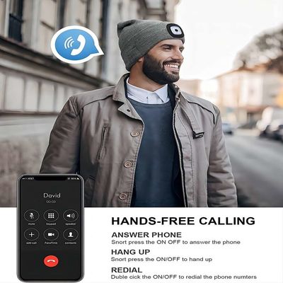 Chapeau ireless gris de casque libre vos mains aux Callings de téléphone de playback de musique